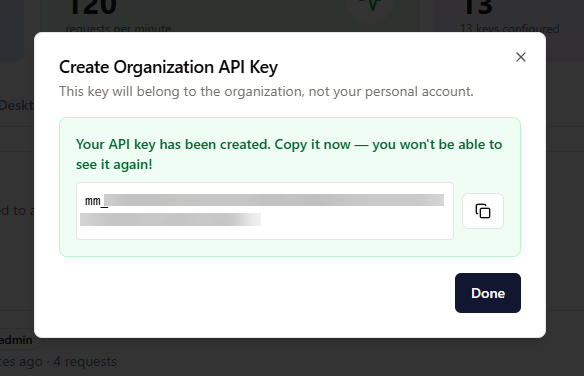 Dialogen “Create Organization API Key” med en kopieringsknapp och en varning om att kopiera nyckeln nu.